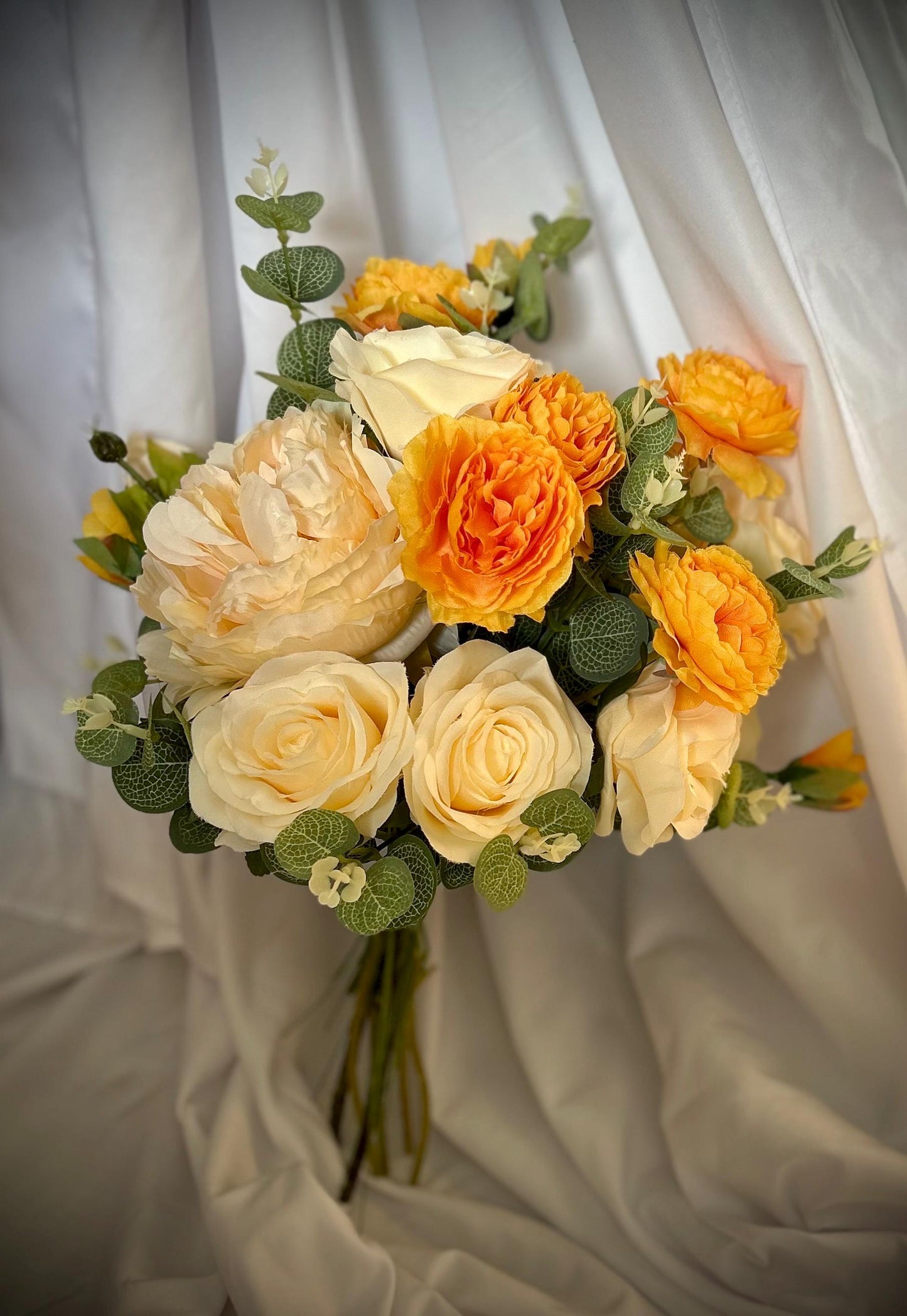 Ivory and golden orange bridal bouquet
