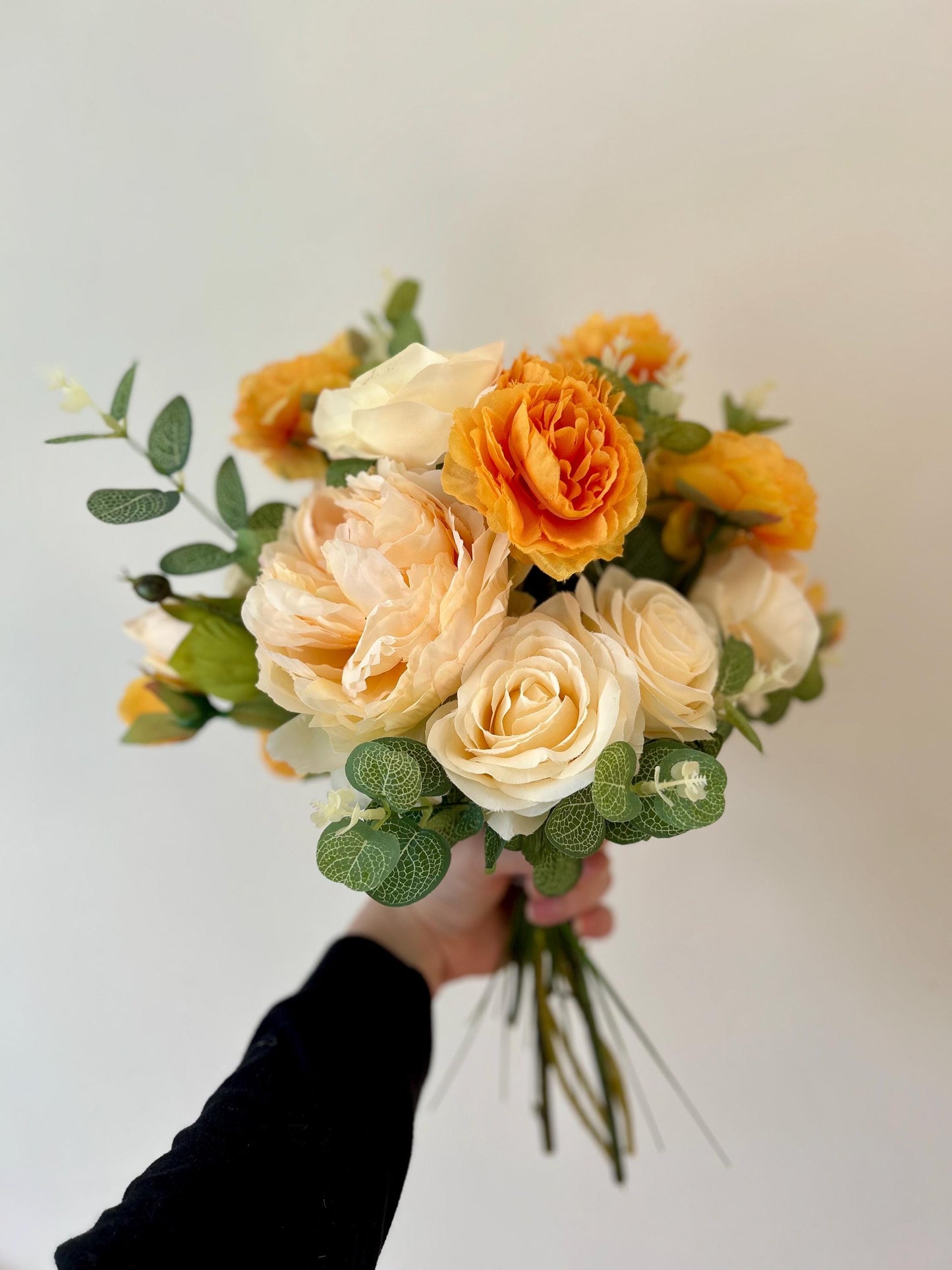 Ivory and golden orange bridal bouquet