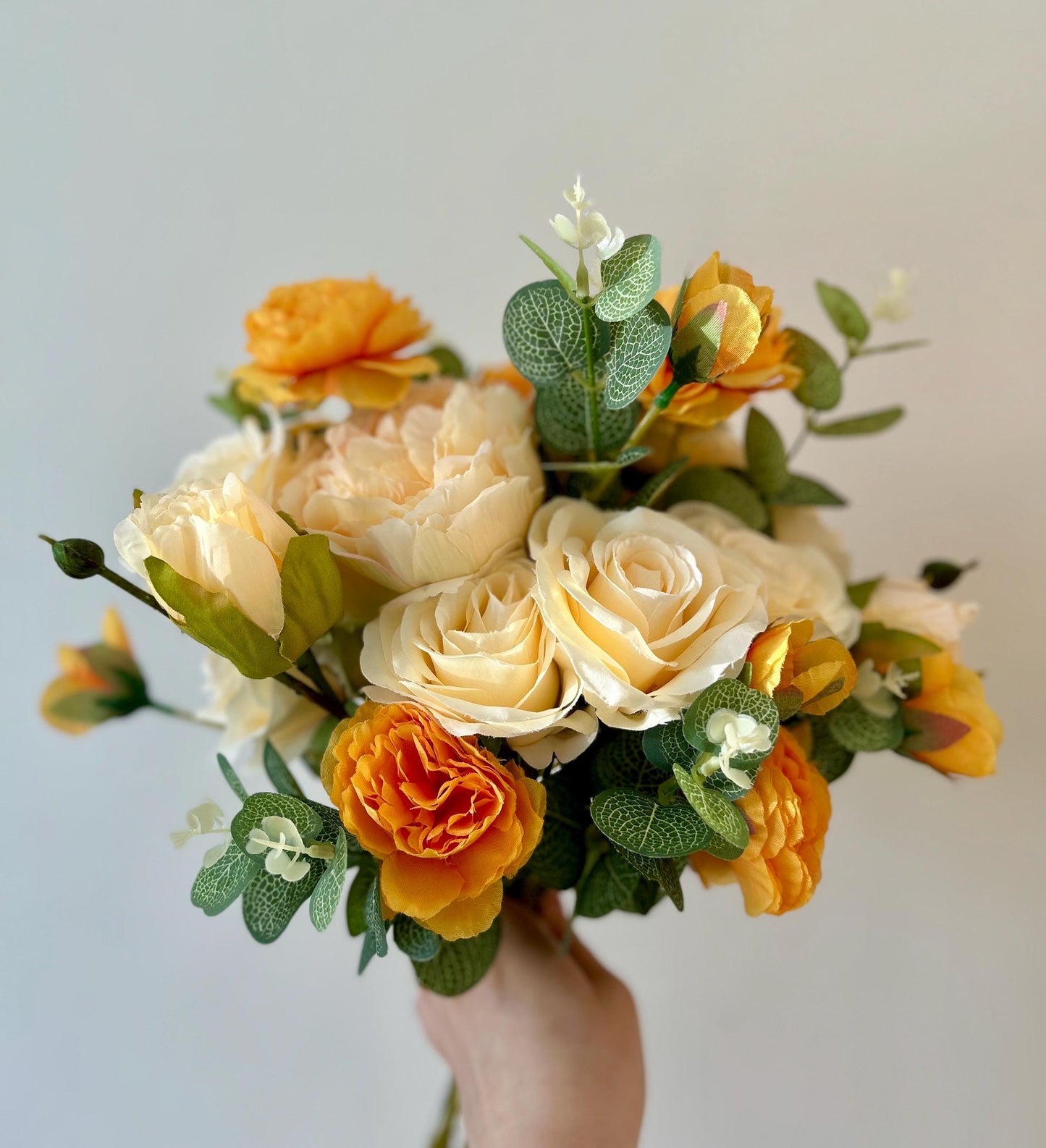 Ivory and golden orange bridal bouquet