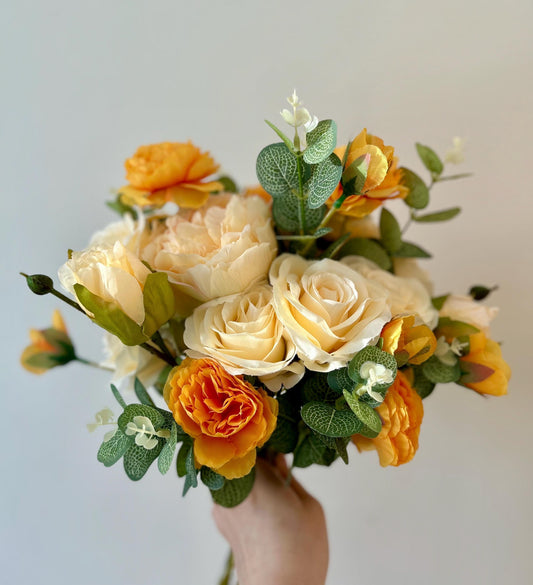 Ivory and golden orange bridal bouquet